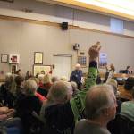 Madison Miller / staff photo                                Supporters of maintaining the recommended zoning for the Providence Heights property raise hands in support of a speaker at the Nov. 12 city council study session.
