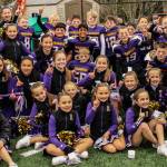 The Issaquah Rookie youth football team celebrates its Greater Eastside Junior Football Association championship along with the cheerleaders. Photo courtesy of Tricia Barry