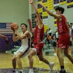 Issaquah guard Saxon Cullimore (left) drives to the paint during an earlier game against Mount Si on Jan. 7. Photo courtesy of Don Borin/Stop Action Photography