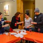 From left: Nicole Ardres, volunteer Wei Geiger, Christine Callo and Michael Eng at a Issaquah Highlands Lunar New Year event. At this Jan. 17 dumpling making workshop, Geiger demonstrated how to fill Chinese dumplings. Courtesy photo by Yuan Yuan Lin.