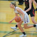 Issaquah guard Cam Gibson carries the ball up the floor during a 4A Wes-King District loser-out game on Feb. 18 at Lynnwood High School. Photo courtesy of Patrick Krohn/Patrick Krohn Photography