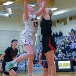 Issaquah senior Katie MacNary (left) drives to the basket during the Eagles 61-35 victory over Newport on Feb. 18 at Lynnwood High School. Photo courtesy of Patrick Krohn/Patrick Krohn Photography