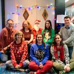 A Kirkland Performance Center staff photo, which was featured on the organizations 2019s holiday card. From left to right: Jeff Lockhart, Anna Espe, Hannah Ekness, David Bander, Mari Cannon, Skye Stoury, Kayla Teel and Jacob Gannon. Photo courtesy KPC