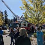 On April 16, first responders from the Eastside gathered with fire trucks outside of Swedish Medical Center in Issaquah to cheer on hospital workers as a sign of appreciation for their work during the COVID-19 pandemic. Corey Morris / staff photo