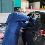 Licensed practical nurse administers a COVID-19 test at the Jamestown Family Clinics drive-up testing site on Dec. 7. Sequim Gazette photo by Michael Dashiell