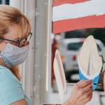 Local artist, <a href="https://www.designsbylisa.com/" target="_blank">Lisa Rasmussen</a> creating window art at Fischer Meats photo credit: <a href="https://www.jennalynnphotog.com/" target="_blank">Jenna Lynn Photography</a>