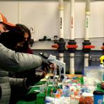 Members of the King County Lab work to preserve kokanee salmon milt to freeze. Photo by Conor Wilson/Valley Record.