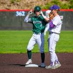 Ethan Barajas (#4) steps on a base as Steven Moore (#20) keeps guard. Courtesy of Patrick Krohn.