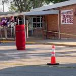 Police lines set up outside of Robb Elementary School in Uvalde, Texas. (Public domain photo courtesy of VOA/Wikipedia)