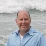 William Shaw smiles at the beach while crashing waves roll in. Courtesy of William Shaw.