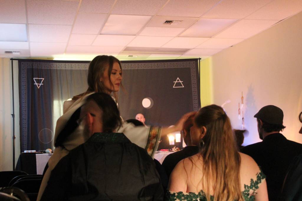 High Priestess Syleena anoints a guest before the Yule ritual. Anointment is a part of many different religious rituals, including Wicca and Christianity. Photo by Bailey Jo Josie/Sound Publishing.