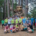 Runners celebrate their 100th run with Jakob Two Trees. (Photo courtesy of Kelly Jiang)