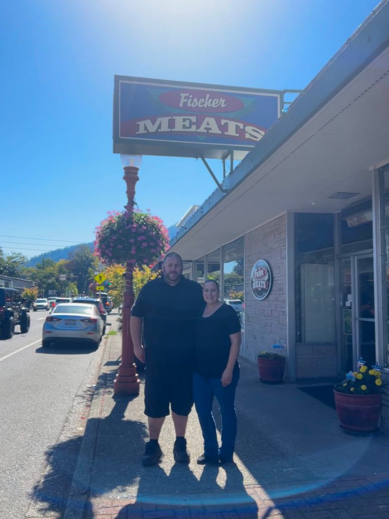 Josh and Corissa McGehe stand out front of their shop, Fischer Meats. (Photo by Cameron Sires)
