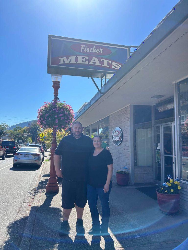 Josh and Corissa McGehe stand out front of Fischer Meats. (Photo by Cameron Sires)
