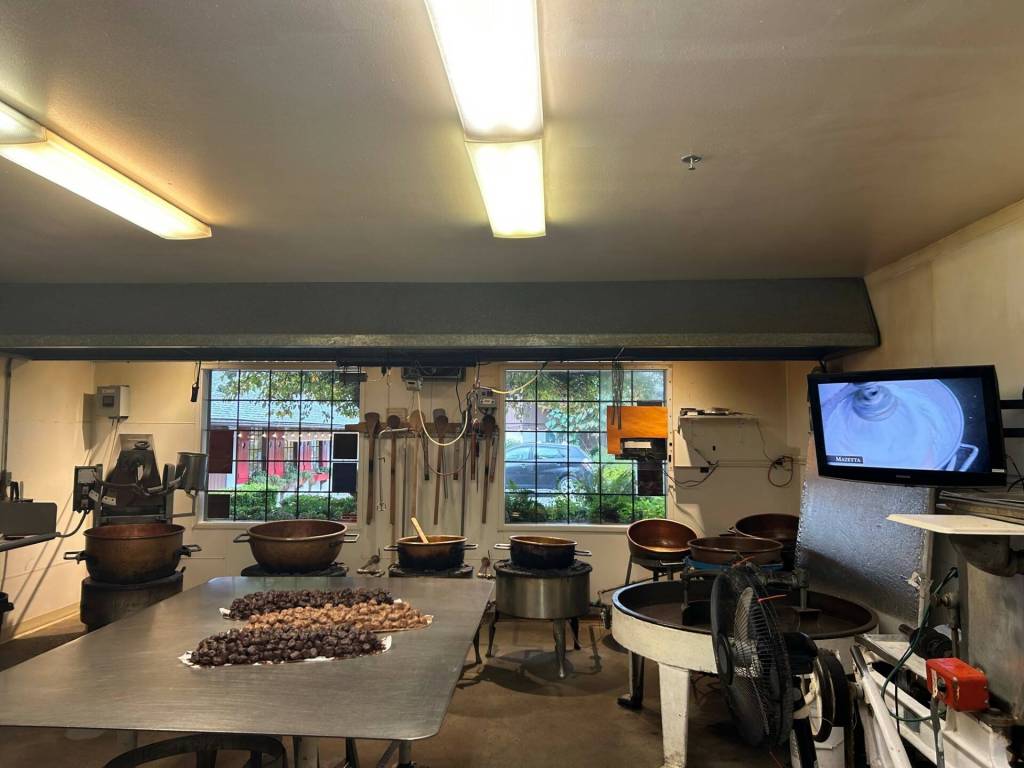 Windows line the walls so customers can watch how Boehms confections are made. At the moment, candy makers were finishing the famous rocky road. (Cameron Sires / Sound Publishing)