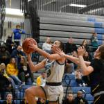 Senior Annabelle Le goes up for a layup against Bellevue. Ben Ray / The Reporter