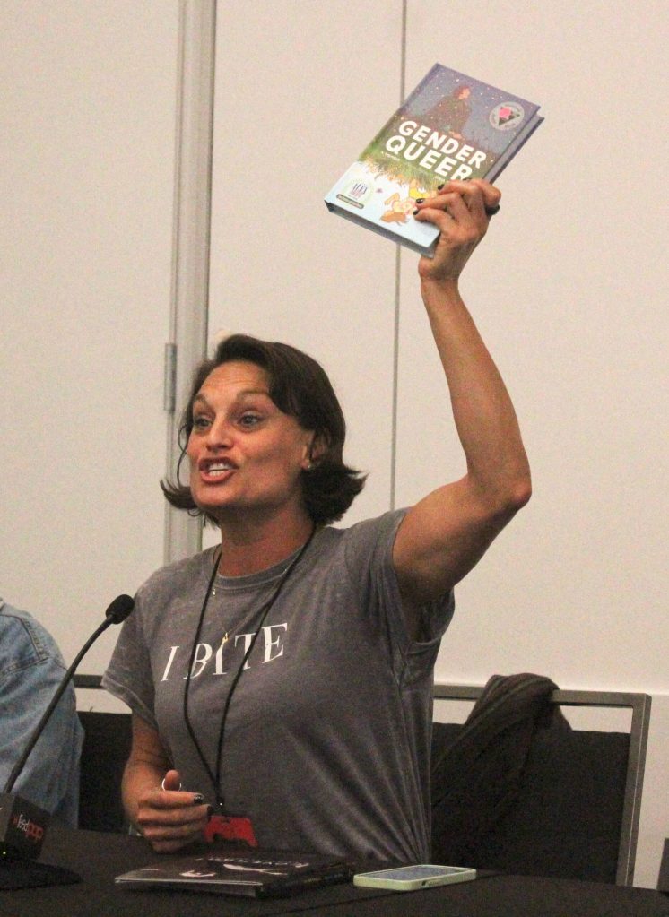 Writer Olivia Cuartero-Briggs holds up Gender Queer: A Memoir by Maia Kobabe, the most banned book in the United States, during an ECCC 2024 panel about banned books. Photo by Bailey Jo Josie/Sound Publishing