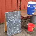 The farmers market offers a wash-off station for fruits and veggies, allowing people to eat on the go. (Cameron Sires/ Sound Publishing)