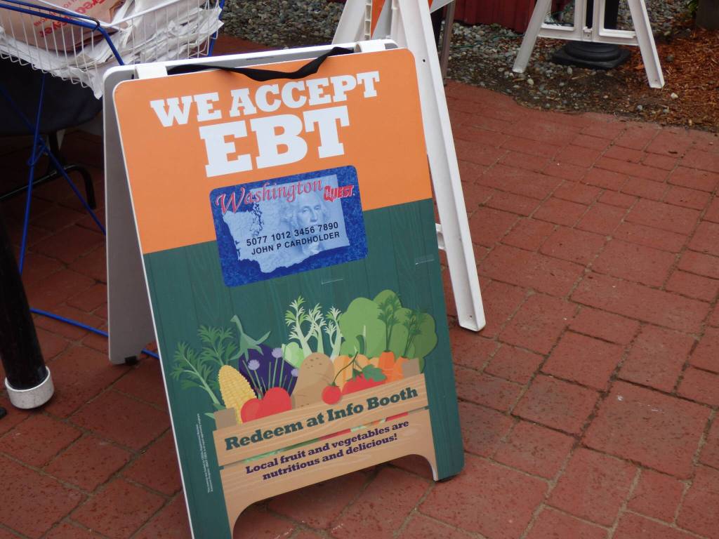 In the information booth at the front of the farmers market, people can redeem SNAP and EBT benefits for Market Bucks. All vendors accepting Market Bucks will have a sign that says, Issaquah Market Bucks accepted here. (Cameron Sires/ Sound Publishing)