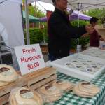 Cascade Valley Farm, based in Redmond, offers fresh salsa, hummus, pita bread and tortilla chips. The vendor also sells pickled items, including spicy onions, spicy garlic, spicy and non-spicy dill pickles, jalapeños and carrots. (Cameron Sires/ Sound Publishing)