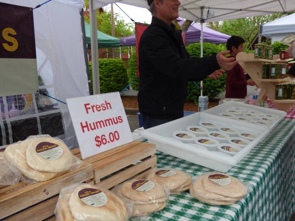Cascade Valley Farm, based in Redmond, offers fresh salsa, hummus, pita bread and tortilla chips. The vendor also sells pickled items, including spicy onions, spicy garlic, spicy and non-spicy dill pickles, jalapeños and carrots. (Cameron Sires/ Sound Publishing)
