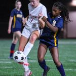 Eastlake senior Grace Schorr, left, and Bellevue freshman Paris Baker fight for possession. Photo courtesy of Stephanie Ault Justus