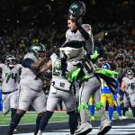 Seattle Seahawks tight end Eric Saubert is lifted up by his teammates after scoring the game-winning 2-point conversion against the Los Angeles Rams on Thursday, Dec. 18, at Lumen Field in Seattle. (Photo courtesy of the Seattle Seahawks)