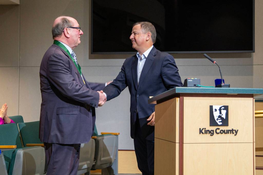 Dively shakes Councilmember Rod Dembowskis hand after being honored for more than 15 years of service. Photo courtesy of King County
