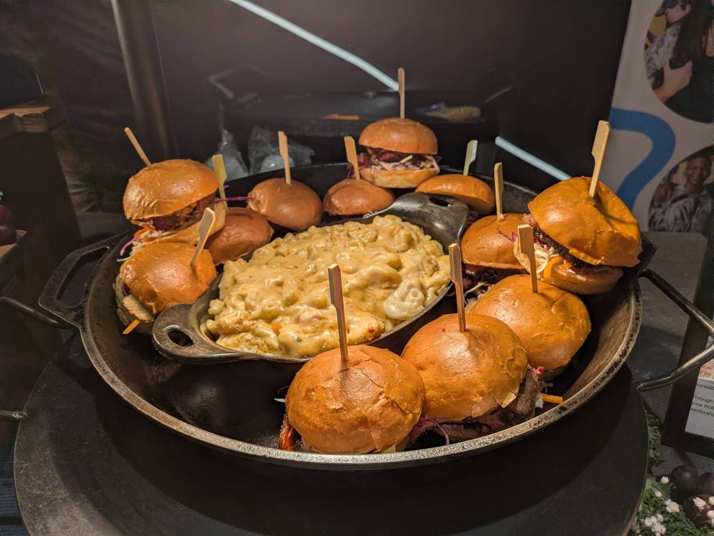 Rolling Smoke BBQ brisket sandwich, with coleslaw, pickles and crispy onions on a brioche bun, surrounding thier BBQ loaded mac and cheese. Photo by Bailey Jo Josie/Sound Publishing