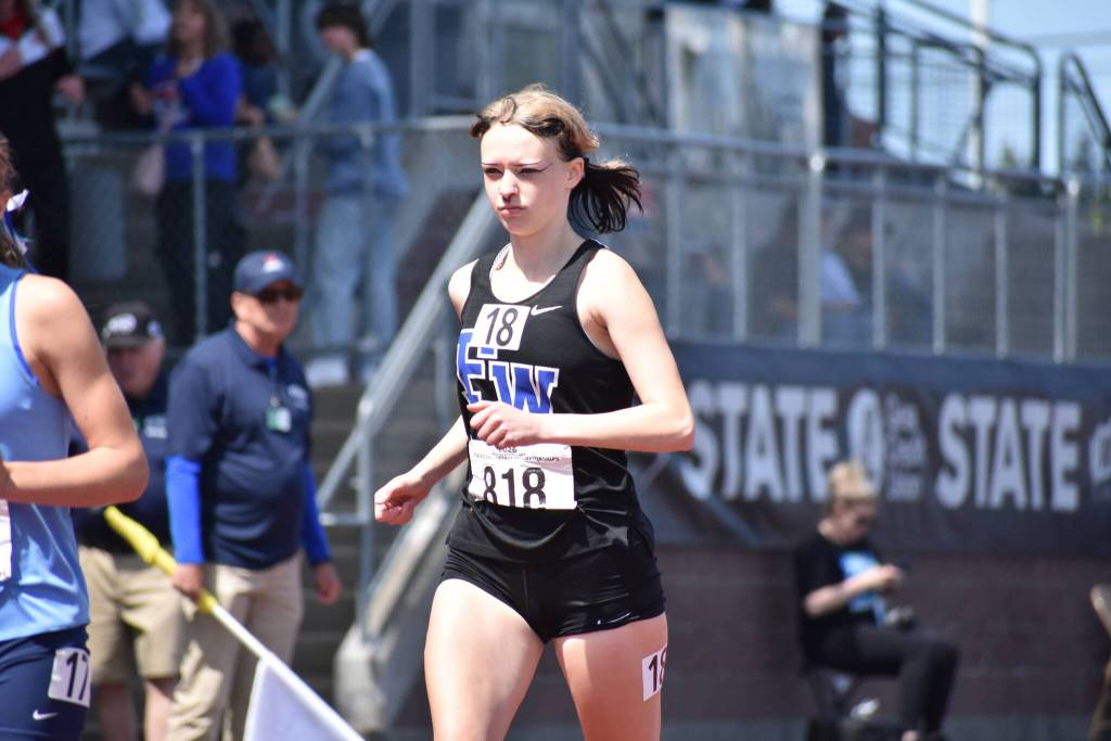Abigail Collier runs the 3200 for Federal Way. Ben Ray / Sound Publishing